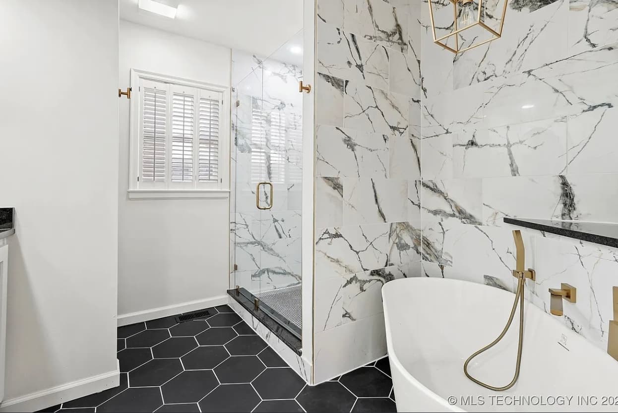A finished Premier bathroom remodel with tiled shower and tub in the Tulsa metro